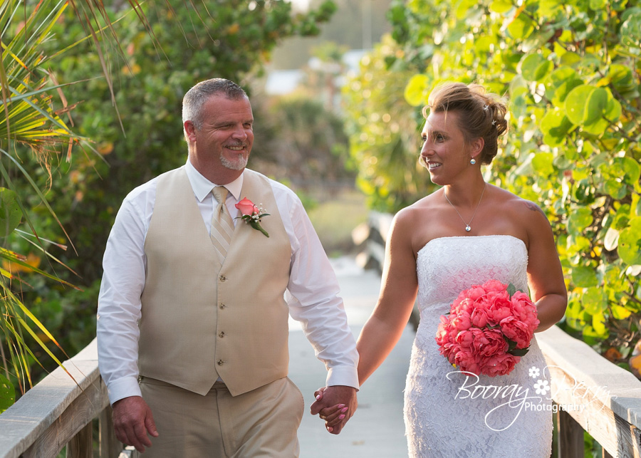 bride and groom walking on florida beach