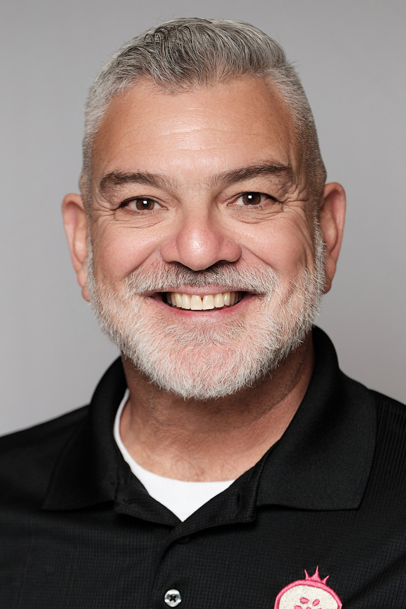 Man with beard in a headshot from an event in Tampa